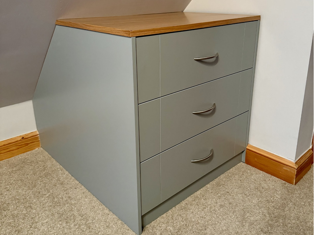 Bespoke fitted chest of drawers built into an alcove
